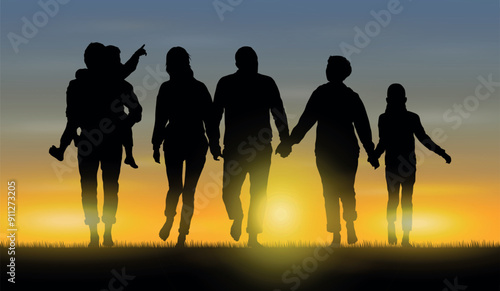 Silhouette of big family walking together barefoot on grass field outdoor at sunset time .