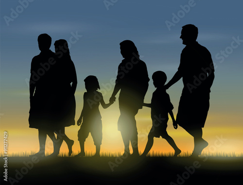 Big family walking together barefoot in grass field during  sunset time silhouettes.