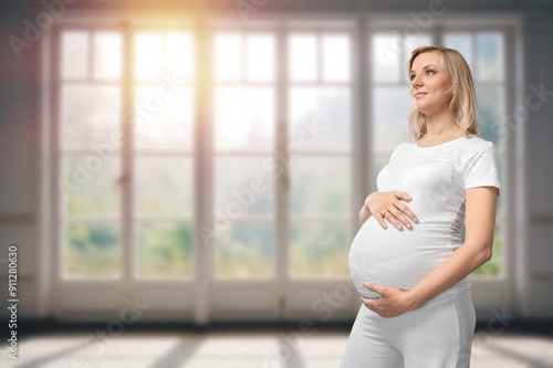 Happy young pregnant woman holds belly Free Download Happy young pregnant woman holds belly - GFXLoad