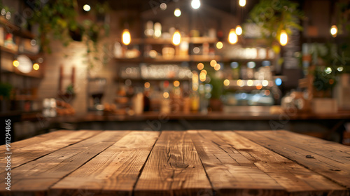 A wooden table with a view of a restaurant. The table is empty and the restaurant is dimly lit