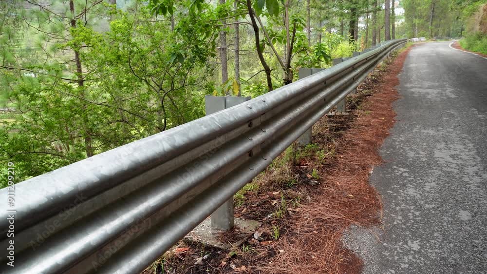 Traffic barriers, also known as guardrails or guard rails, positioned in the hills of Uttarakhand, India, to enhance road safety.