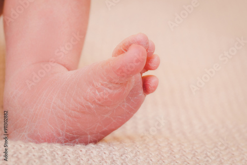 Newborn baby details. The foot of a newborn child. Tenderness and love from birth. Care and raising of children health. Happy Family concept. photo