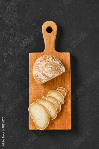 Overhead view of chopping board with traditional Georgian cheese Dambalkhacho photo