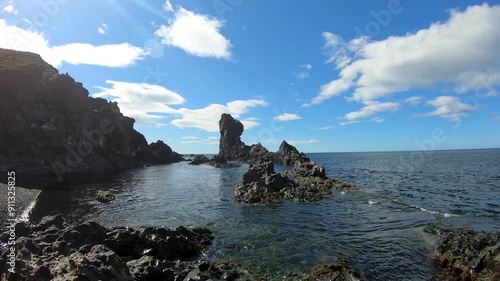 A scenic view of the Djupalonssandur beach, with volcanic lava rocks at Snaefellsjokull National Park, Iceland photo