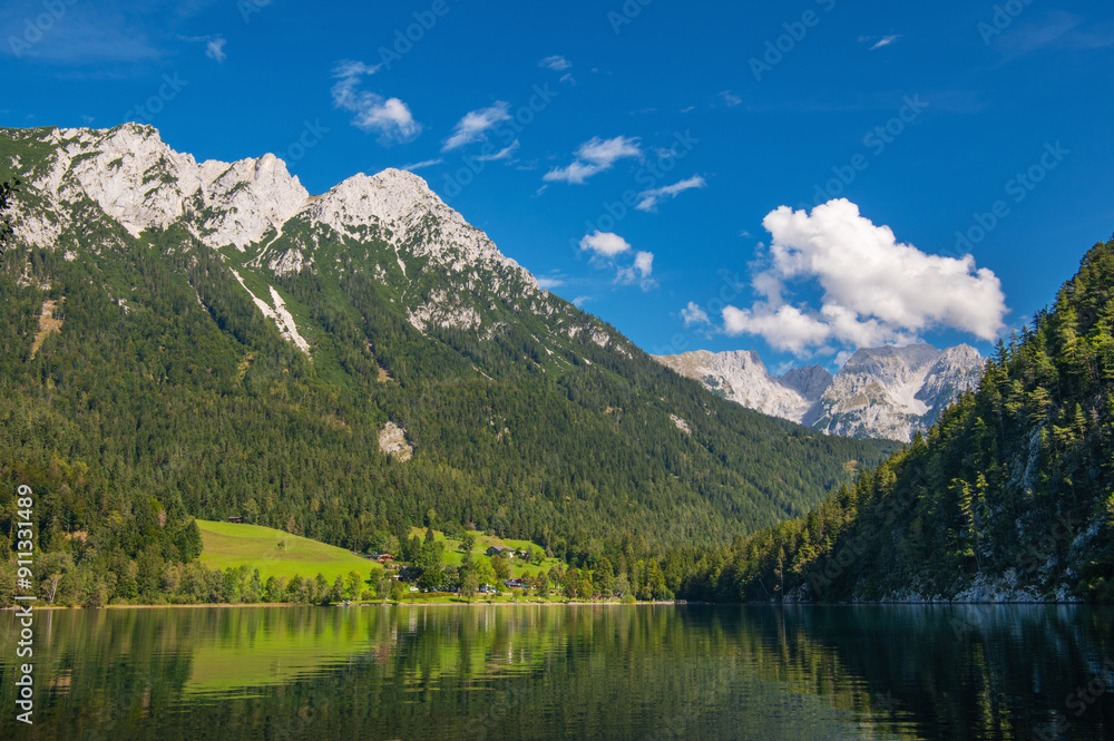 Kaisergebirge Mountains at the Austrian Alps with view to the mountain lake Hintersteiner See. Wilder Kaiser Austrian national park, Scheffau, Tirol, Austria. Nature landscape Kaisergebirge Mountains at the Austrian Alps with view to the mountain lake Hintersteiner See. Wilder Kaiser Austrian national park, Scheffau, Tirol, Austria. Nature landscape