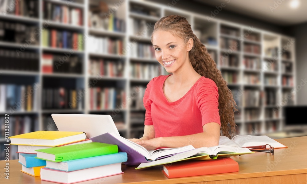 Happy thinking woman student study in library Happy thinking woman student study in library
