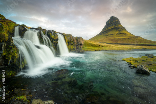 Kirkjufellfoss waterfall in Iceland with the iconic Kirkjufell mountain