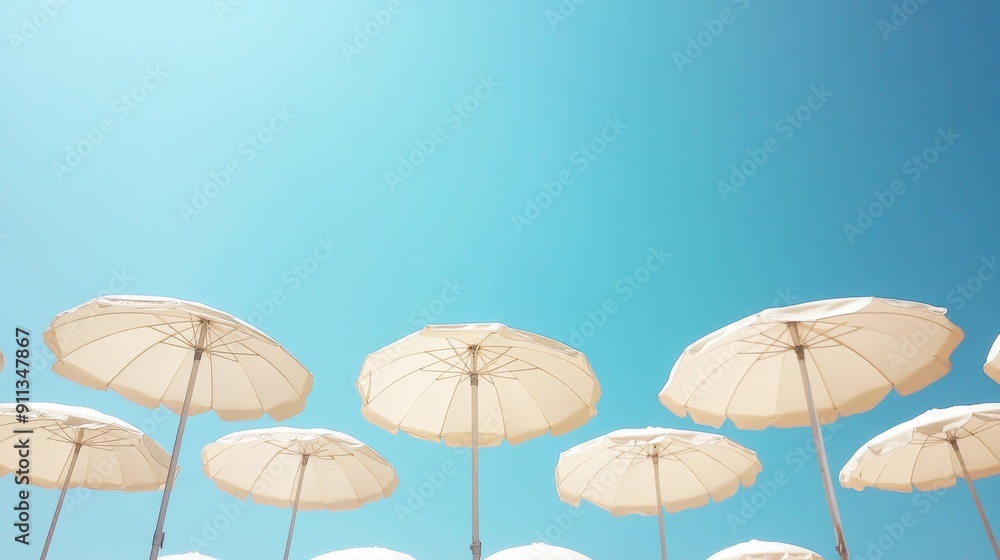 white beach umbrellas under clear blue sky white beach umbrellas under clear blue sky