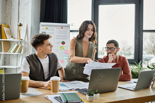 Colleagues engage in a serious discussion in an open workspace.