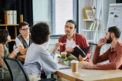 Картината върху платно Team members share thoughts during a challenging moment at work.