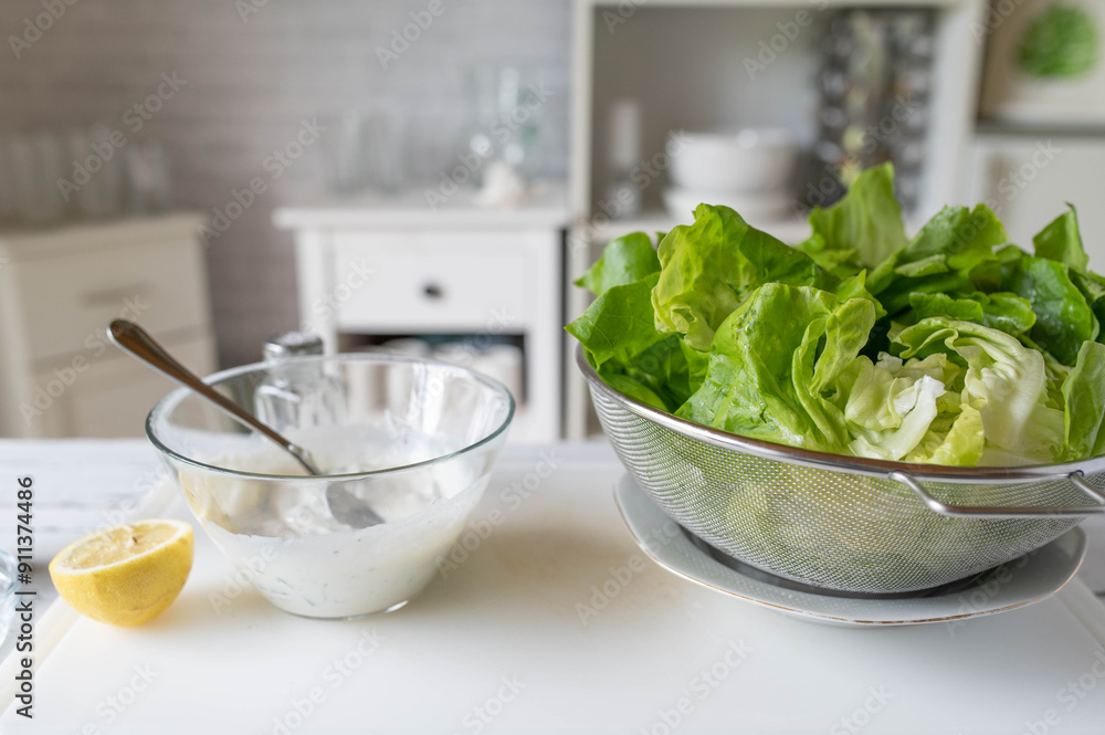 Fresh prepared healthy salad dressing with yogurt and herbs for marinating a green salas Fresh prepared healthy salad dressing with yogurt and herbs for marinating a green salas