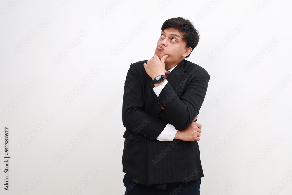 Young Asian Businessman standing while thinking. Isolated on white Young Asian Businessman standing while thinking. Isolated on white