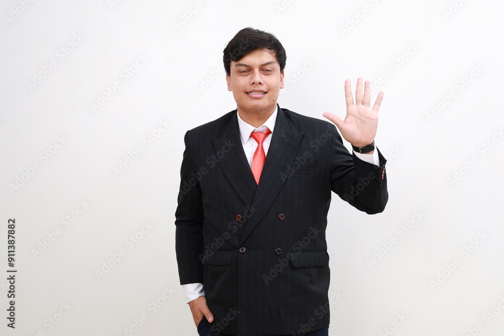 Young and handsome Asian businessman in a suit showing number five hand gestures. Young and handsome Asian businessman in a suit showing number five hand gestures.