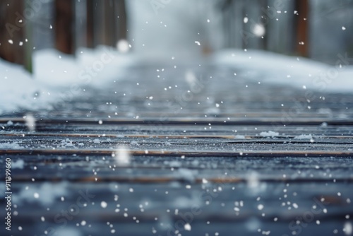 Soft snowflakes gently fall on a wooden path creating a winter wonderland, evoking feelings of serenity and magic.