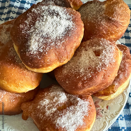 Close-up of homemade sugar coated doughnuts on a plate, traditional hungarian dish named 