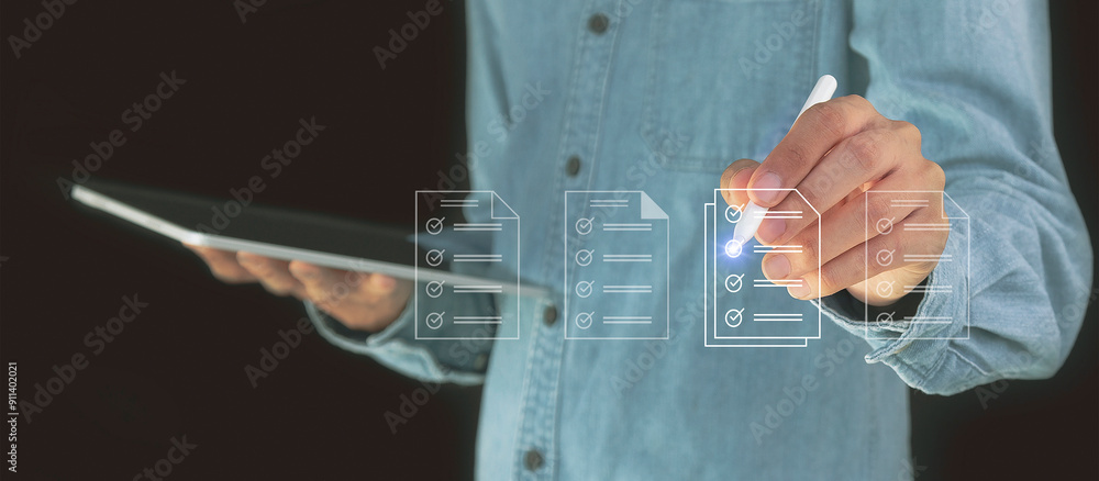 Fototapeta premium Concept of electronically checking smart items and documents on a virtual screen. Businessman checks electronic documents Borderless communication technology