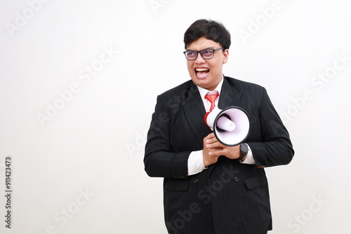 фотографія Young employee businessman wear formal suit glasses work in office hold scream m