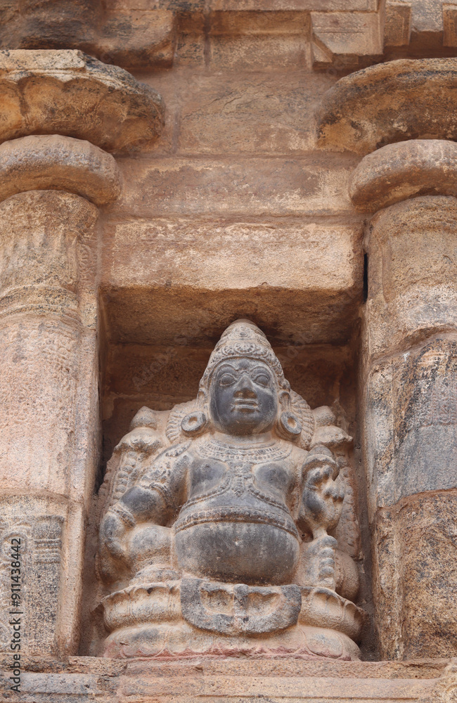 sculpture is carved into a thousand-year-old temple wall. sculpture is carved into a thousand-year-old temple wall.