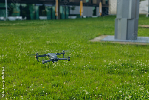 Fast and safe delivery. A drone delivers a gift to a girl, contactless delivery photo