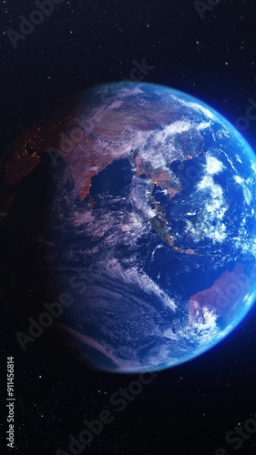 Zoom out to the planet earth seen from a space flight or satellite. The transition between day and night can be observed. Background of the globe or world rotating