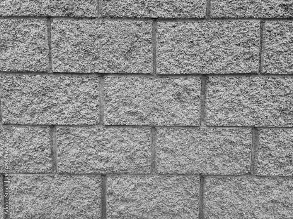 Fototapeta premium Old brick wall pattern close view background, stone texture surface. Black and white monochrome grayscale photo