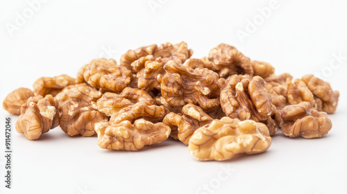 Dried walnut kernels arranged on a white background. These nutrient-rich nuts are a convenient and healthy snack.