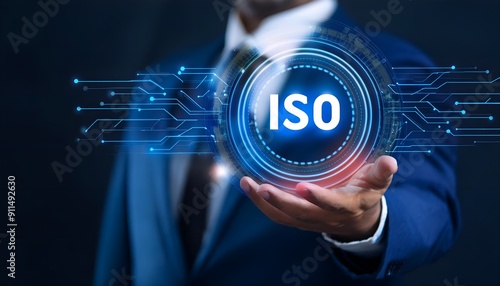 Guarantee of quality control of ISO standards. Businessman holds a shiny iso in his hand