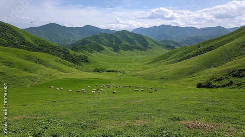 Cattle peacefully graze on vibrant green fields, framed by dramatic mountains under a partly cloudy sky at the golden hour