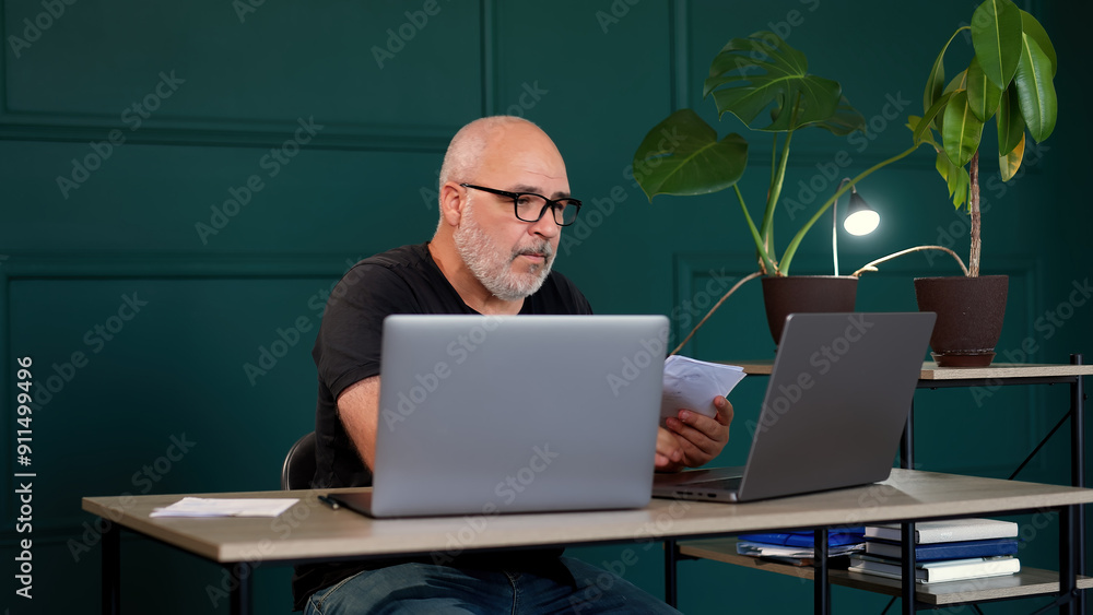 Ideal for topics of innovation, technology development and collaborative problem solving. Professional male programmer brainstorming in a modern office. Ideal for topics of innovation, technology development and collaborative problem solving. Professional male programmer brainstorming in a modern office.