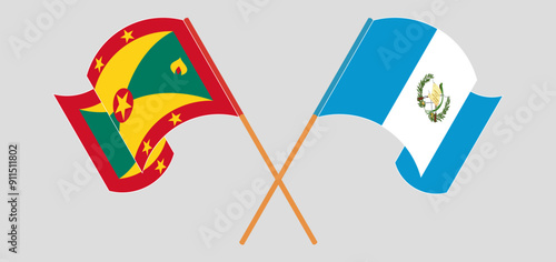 Crossed and waving flags of Grenada and Republic of Guatemala