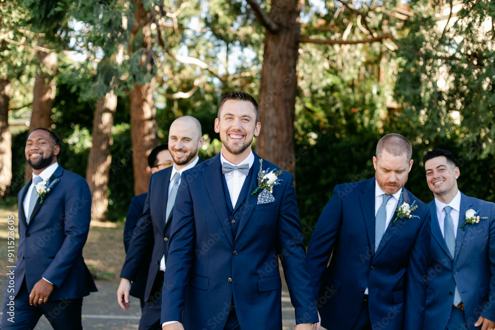 Groom and Groomsmen Walk Together after the Wedding Ceremony Groom and Groomsmen Walk Together after the Wedding Ceremony