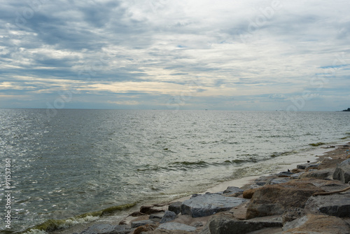 Beach with rocky and clear water at Bang Saen Beach, Chonburi, Thailand photo