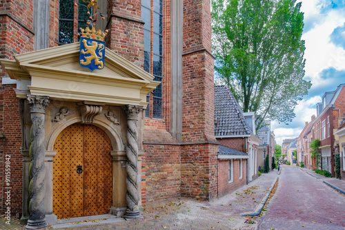 street and entrance of Great or Jacobin  Church from year 1310  in Leeuwarden,  which is capital of Friesland and one of the Eleven Cities of Friesland in The  Netherlands photo