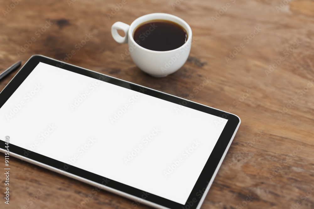 Man working on tablet and coffee on table. office business computer concept. man working on wooden table with a tablet and coffee. a man working on a wooden table with a tablet and lifestyle coffee. Man working on tablet and coffee on table. office business computer concept. man working on wooden table with a tablet and coffee. a man working on a wooden table with a tablet and lifestyle coffee.