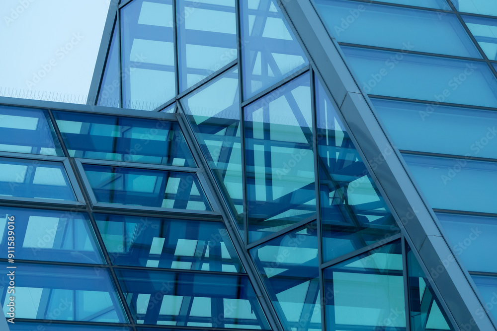 Glass roof in modern commercial building, greenhouse. Metal frame structure. Modern architecture. Fragment. Architectural background Glass roof in modern commercial building, greenhouse. Metal frame structure. Modern architecture. Fragment. Architectural background