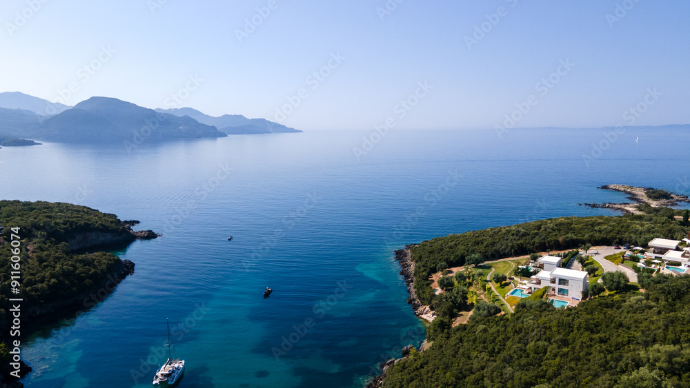 Aerial view of expensive residential houses in island small town Syvota Greece. American dream homes as example of real estate development in US suburbs Aerial view of expensive residential houses in island small town Syvota Greece. American dream homes as example of real estate development in US suburbs