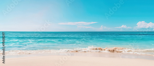 Stunning beach scene with turquoise waters, soft sand, and a clear blue sky, perfect for relaxation and tropical escape.