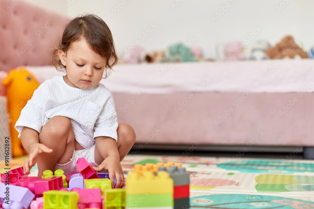 cute baby girl playing with colorful toys bricks at home, copy space cute baby girl playing with colorful toys bricks at home, copy space
