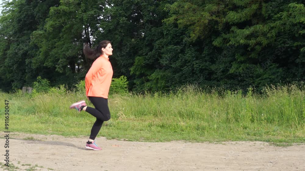 Woman makes exersices in the morning before jogging Woman makes exersices in the morning before jogging