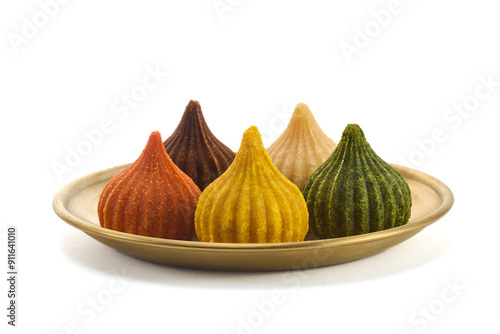 Ganesh Chaturthi Festival. Colorful Modaks Indian sweet dumpling on Plate photo