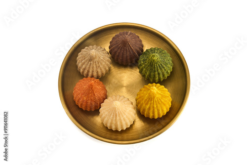 Ganesh Chaturthi Festival. Colorful Modaks Indian sweet dumpling on Plate