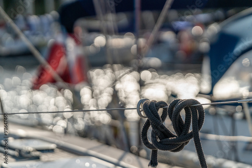 yacht in the harbor with danish flag waving on a blue sky photo