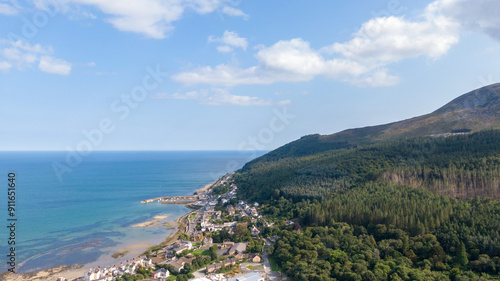 Aerial view on houses on coast of see in Newcastle, Northern Ireland. Coastal town, Drone photo