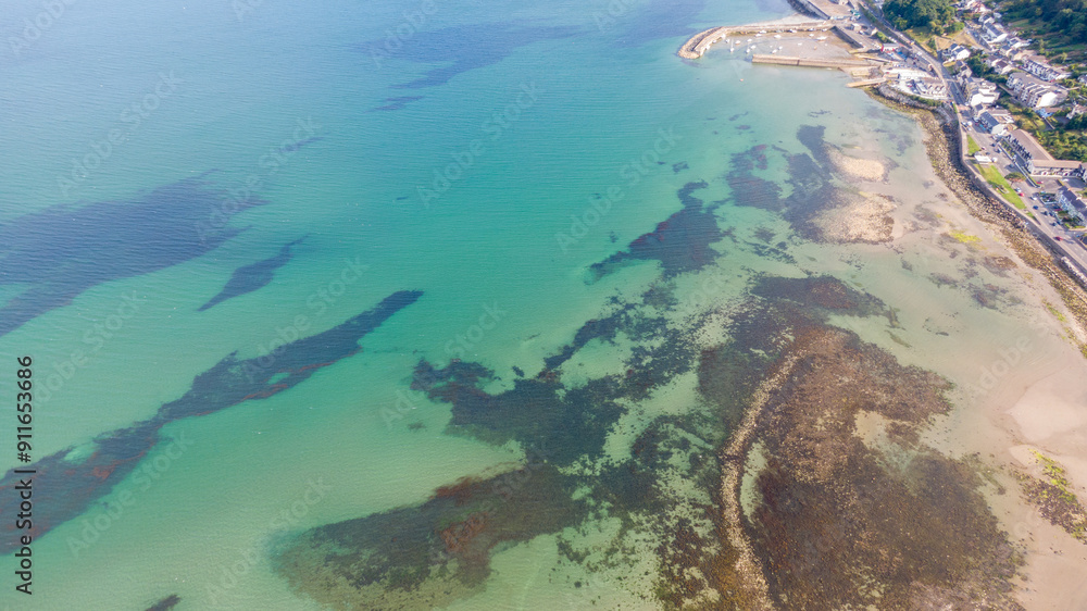 Aerial view on houses on coast of see in Newcastle, Northern Ireland. Coastal town, Drone photo Aerial view on houses on coast of see in Newcastle, Northern Ireland. Coastal town, Drone photo