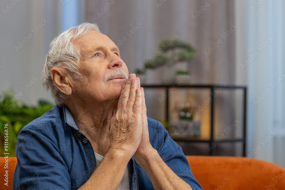 Please, God help. Worried senior old man praying for heath sincerely with folded arms looking upward making wish asking hopeful imploring expression begging apology at home. Elderly mature grandfather Please, God help. Worried senior old man praying for heath sincerely with folded arms looking upward making wish asking hopeful imploring expression begging apology at home. Elderly mature grandfather