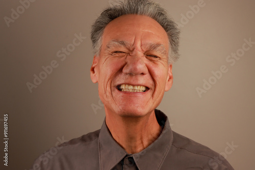 Close up Portrait of a Happy Mature Man smiling