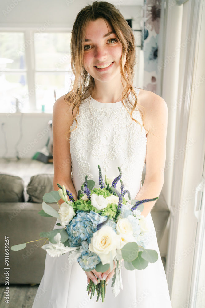portait of young smiling bride indoors before wedding portait of young smiling bride indoors before wedding