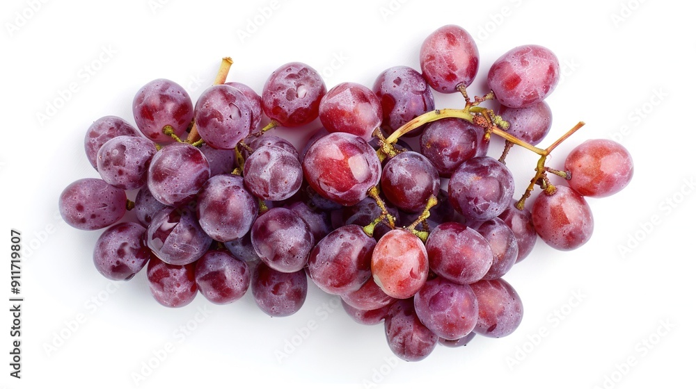 A group of grapes arranged on a white background against a white backdrop A group of grapes arranged on a white background against a white backdrop