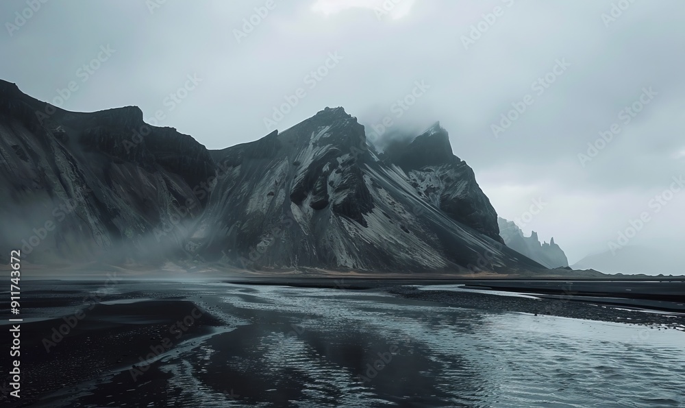 Fototapeta premium Mountains, water and black sand in Iceland