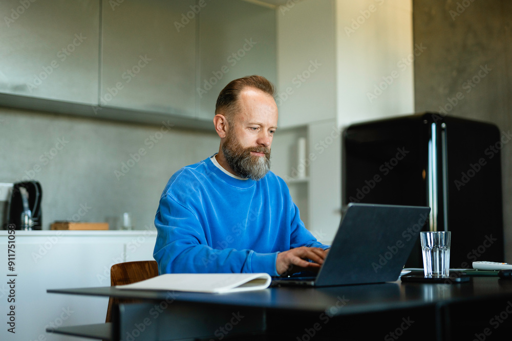 Man typing on a laptop Man typing on a laptop